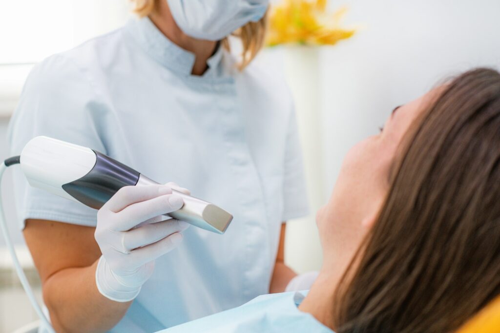 Prosthodontics - Dentist Using 3D Dental Camera for Scanning Teeth.